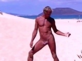 Tanned guy on beach in tiny string thong (temporarily!)