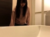 Cute amateur asian web cam girl playing with her toy
